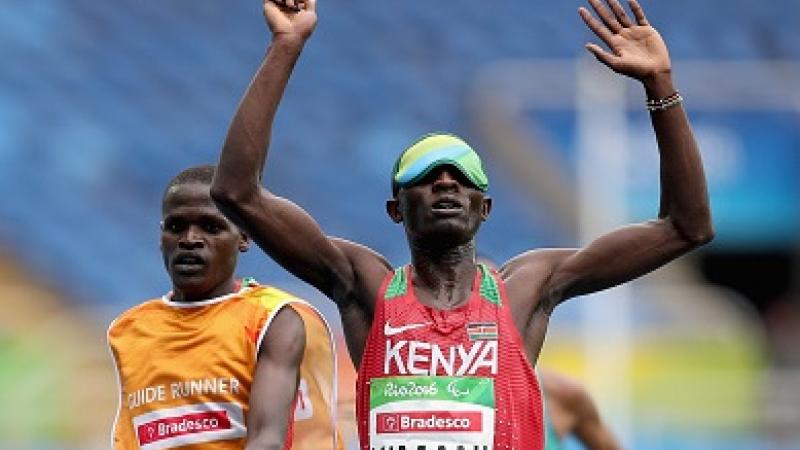 RIO DE JANEIRO, BRAZIL - SEPTEMBER 08: Samwel Mushai Kimani of Kenya crosses the finish line to win the men's 5,000 meter T11 on day 1 of the Rio 2016 Paralympic Games at Olympic Stadium on September 8, 2016 in Rio de Janeiro, Brazil. (Photo by Matthew Stockman/Getty Images)