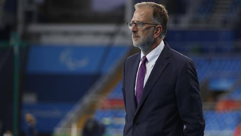 A man stands in a stadium
