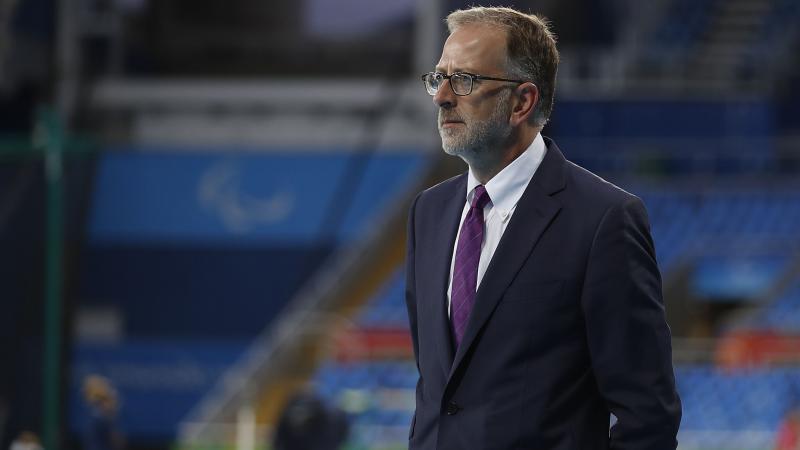 A man stands in a stadium