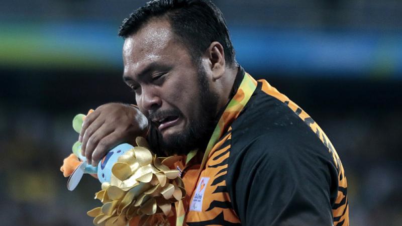 Gold medalist Muhammad Ziyad Zolkefli of Malaysia celebrate on the podium