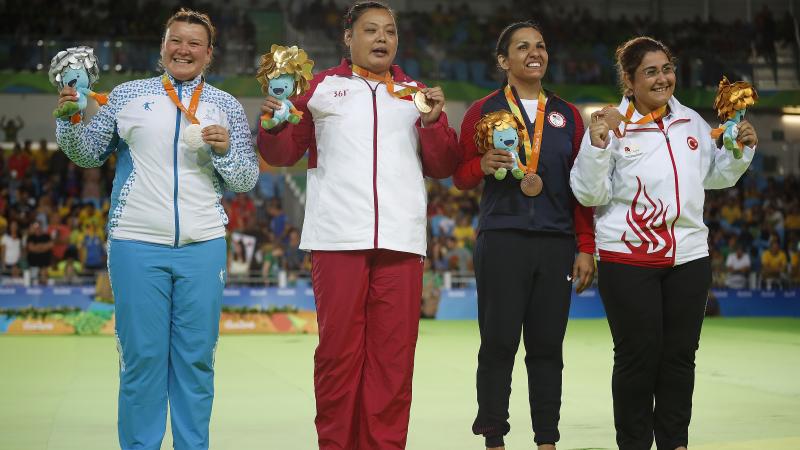 The four medallists from the women's +70kg judo category on the podium at Rio 2016. 