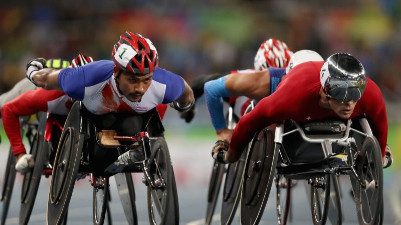 Prawat Wahoram of Thailand and Marcel Hug of Switzerland lead the pack in heat one of the men's 5000m meter T54 at the Rio 2016 Paralympic Games.