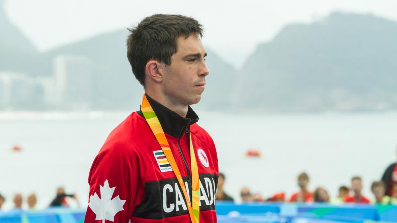 a man stands on a podium