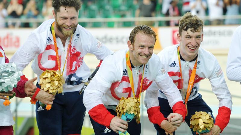 Louis Rolfe, Jon-Allan Butterworth and Jody Cundy celebrate gold medal for team GB