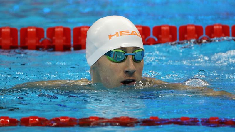 Dmytro Vynohradets' of Ukraine celebrates winning the gold medal in the Men's 50m Backstroke - S3 Final at the Rio 2016 Paralympic Games. 