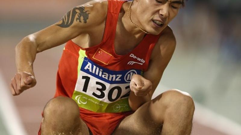 Guangxu Shang of China competes in the men's long jump T37.
