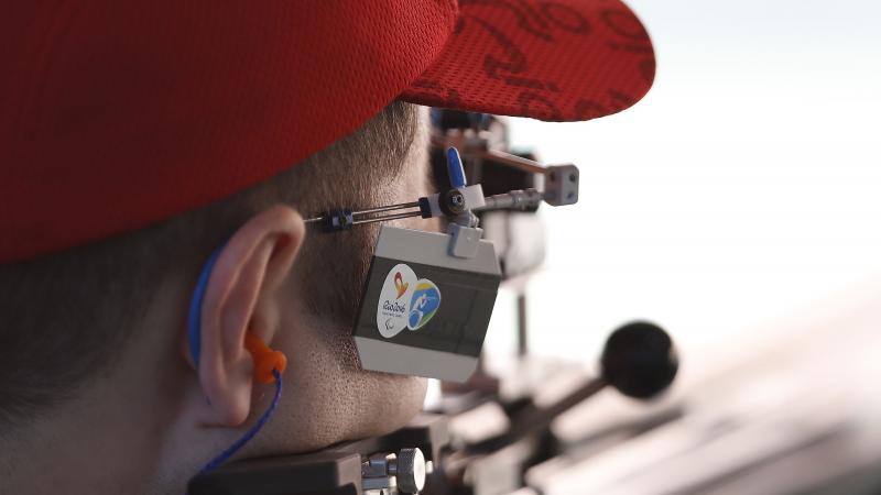 a male Para shooter takes a shot