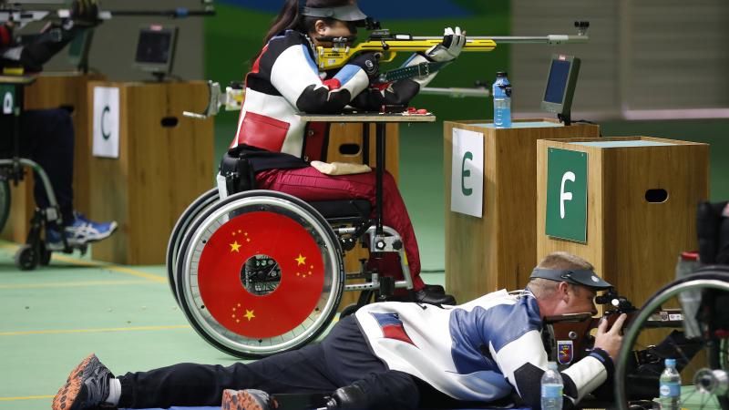 Women in a wheelchair doing para sport shooting