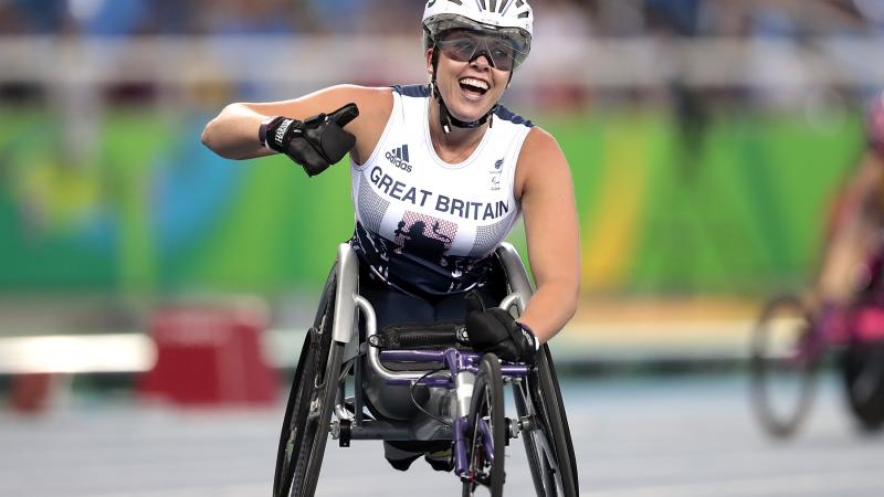 Hannah Cockroft of Great Britain celebrates the victory in the Women's 400m T34 final at Olympic Stadium on day 7 of the Rio 2016 Paralympic Games.