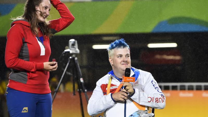Silver medalist David Drahoninsky of the Czech Republic proposes to his girlfried Lida Fikarova after the medal ceremony for the men's individual archery W1 final atthe Rio 2016 Paralympic Games.