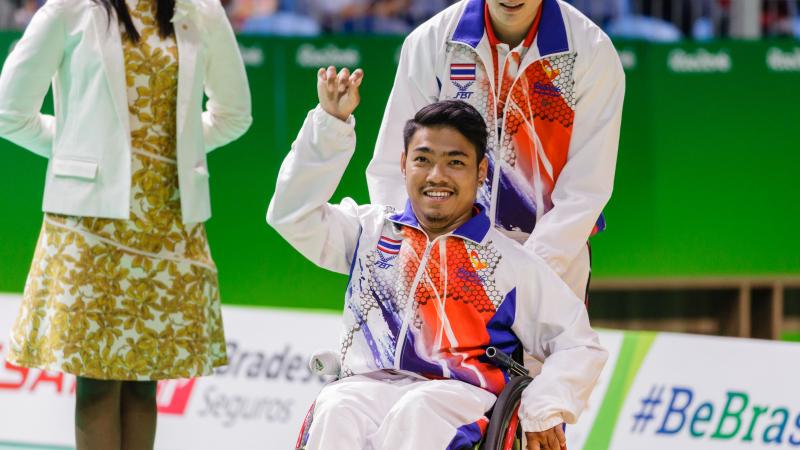 Man in wheelchair celebrating