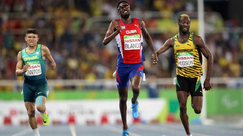 Three men finishing in the men's 400m competition 