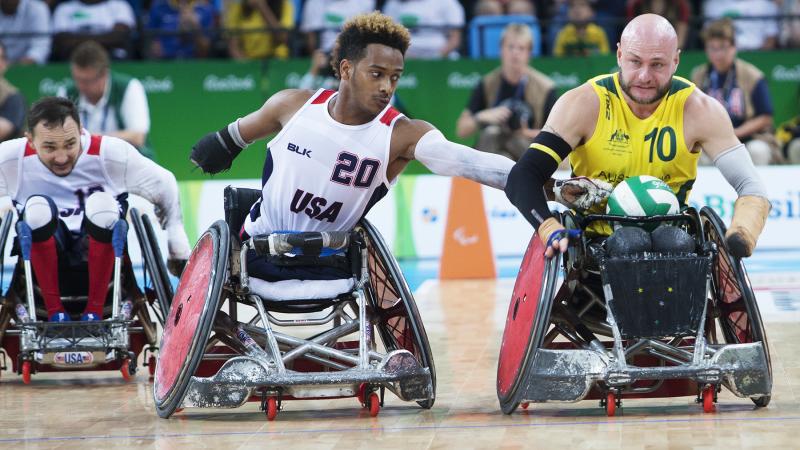 Australia's Chris Bond pushes down the court as USA's Josh Brewer reaches for the ball