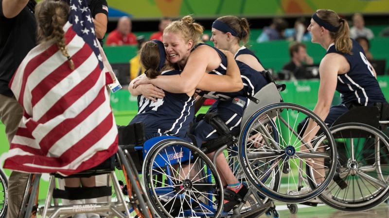 Christina Schwab USA (centre left) and Rose Hollermann USA (centre right) celebrate their team's victory 62 - 45 over Germany in the Wheelchair Basketball Women's Gold Medal Match