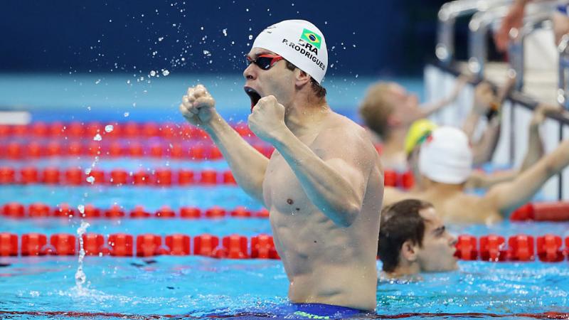 Brazilian swimmer Phelipe Rodrigues celebrating in the pool.