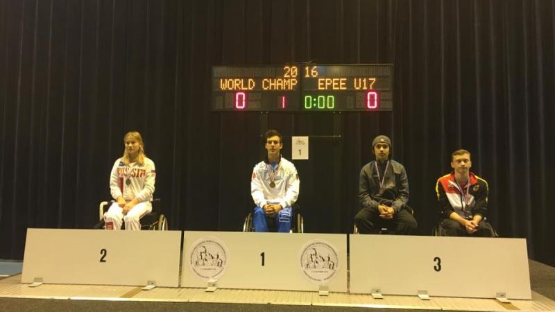 Podium with three athletes in wheelchairs