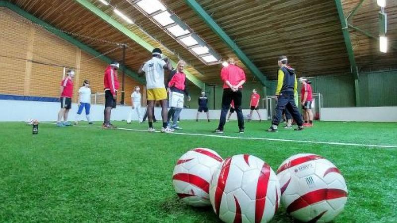 A female trainer coaches blind players in Vienna, Austria.