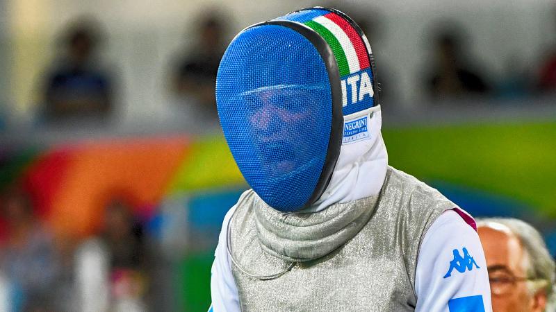 Wheelchair fencer celebrates with her mask on