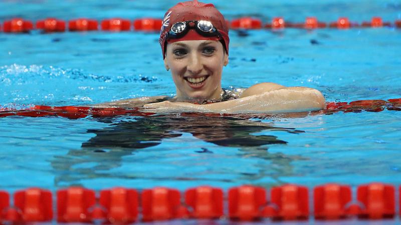 Bethany Firth of Great Britain celebrates winning the gold medal in the Women's 100m Backstroke - S14 Final at the Rio 2016 Paralympic Games.