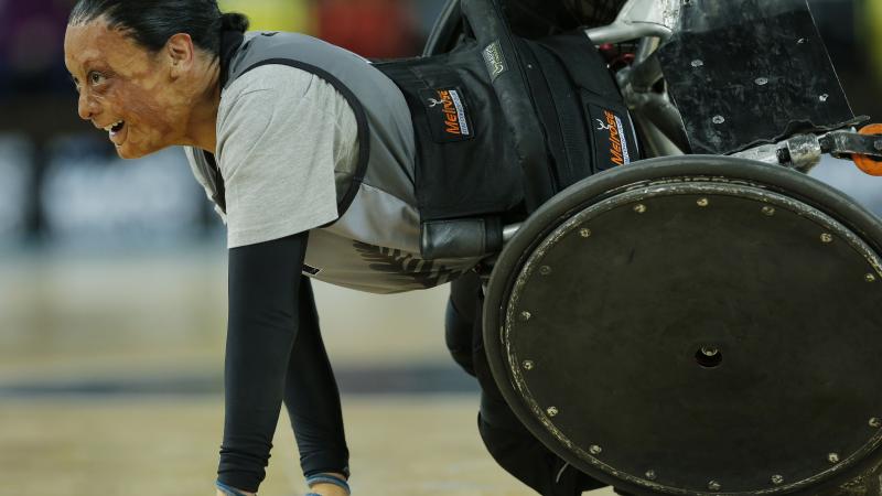 Maia Amai of New Zealand (probably the strongest female player in the game) smiles after being knocked over during a match