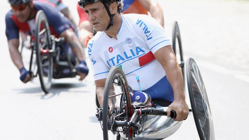 Handcyclist going through a curve