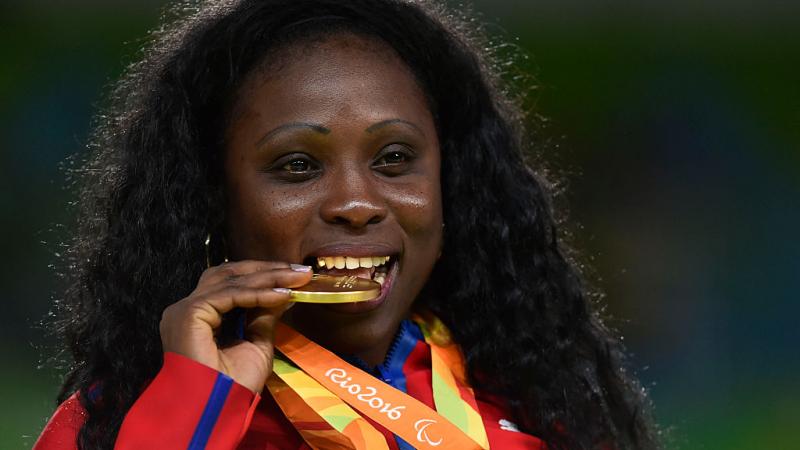 Gold medalist Dalidaivis Rodriguez of Cuba celebrate on the podium at the medal ceremony for the the Women - 63 kg Judo during day 2 of the Rio 2016 Paralympic Games.