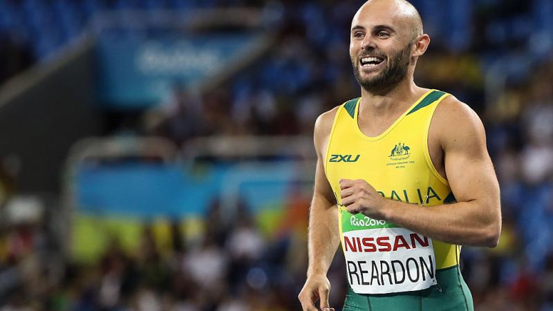 Scott Reardon of Australia celebrate winning the gold medal in the Men's 100m - T42 Final on day 8 of the Rio 2016 Paralympic Games