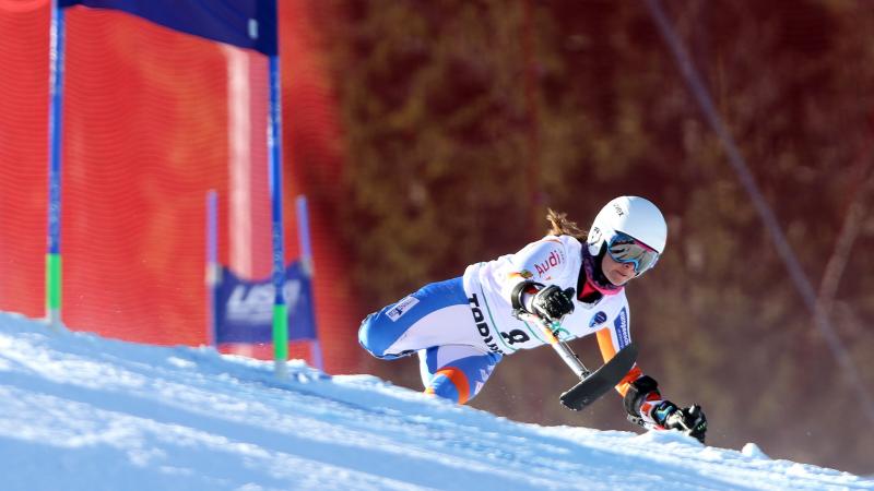 downhill skier going through a gate