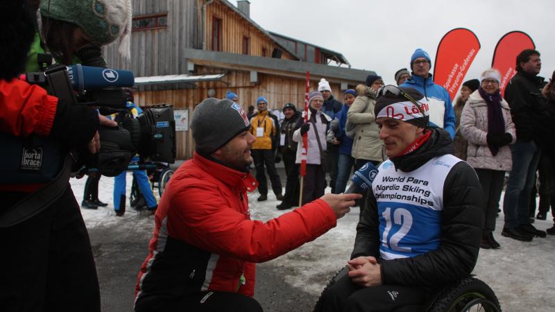 a para Nordic skier being interviewed