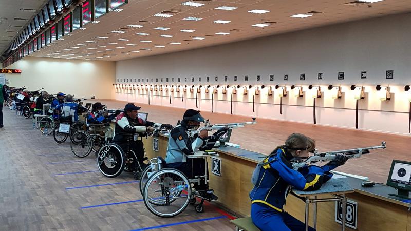 Shooting range with athletes in action