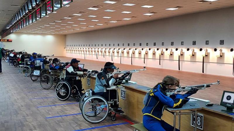 A series of Para sport shooters take aim on the shooting range
