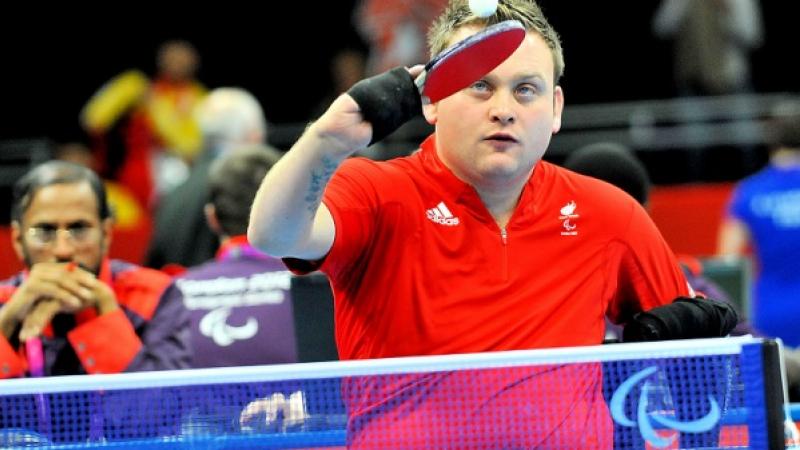 Upper body of man playing table tennis