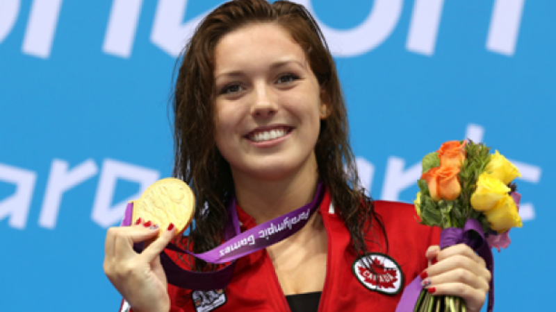 Summer Ashley Mortimer A picture of woman showing her gold medal