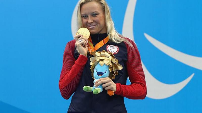 Gold medalist Jessica Long of the United States celebrates on the podium at the medal ceremony for Women's 200m Individual Medley - SM8 at the Rio 2016 Paralympic Games.