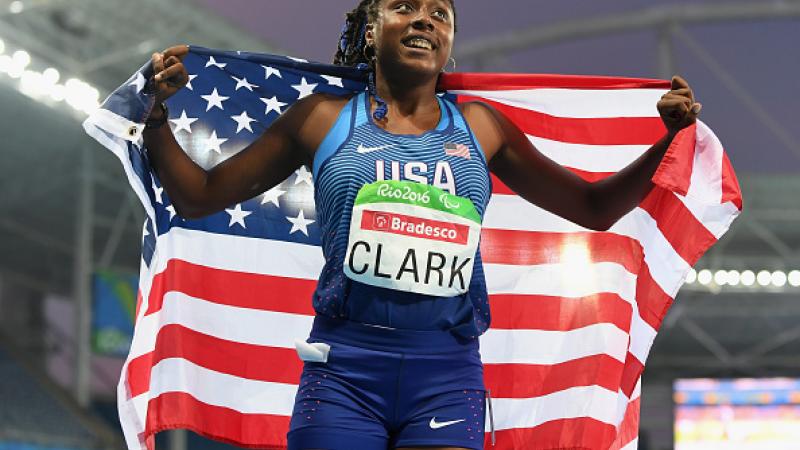 Breanna Clark of the United States celebrates winning the gold medal in the Women's 400m - T20 Final on day 6 of the Rio 2016 Paralympic Games