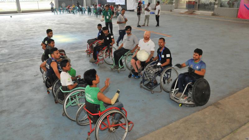 Men in wheelchairs line up for a drill