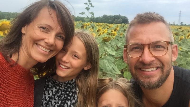 Selfie of a woman, her husband and their two daughters