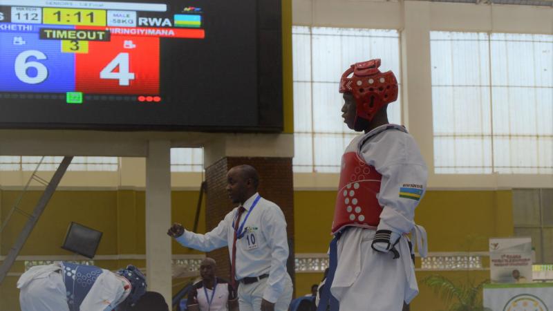 Man in taekwondo uniform at a competition