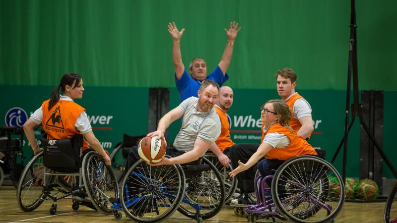 People playing wheelchair basketball