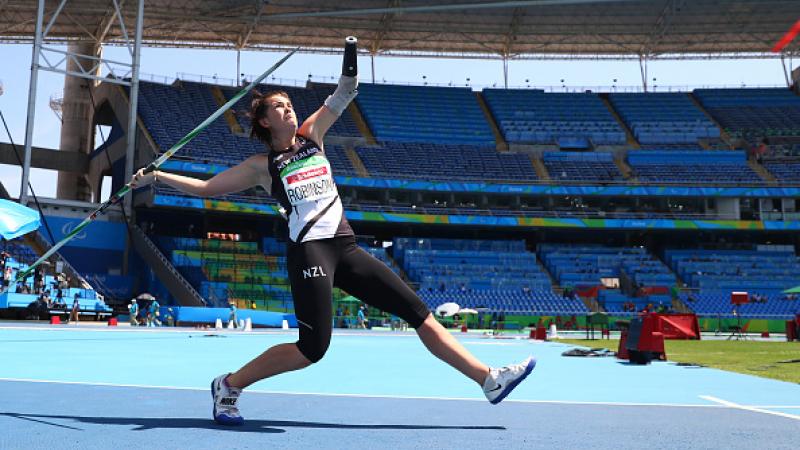 Woman throws a javelin 