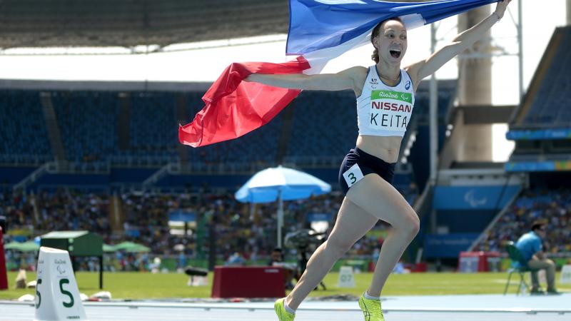 France's Nantenin Keita celebrates victory in the women's 400m T13 final at the Rio 2016 Paralympic Games.