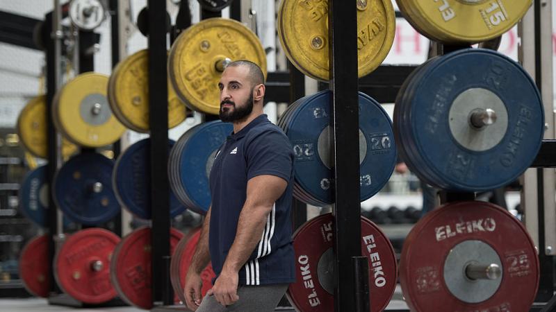 GB powerlifter Ali Jawad poses in weight room at Loughborough University