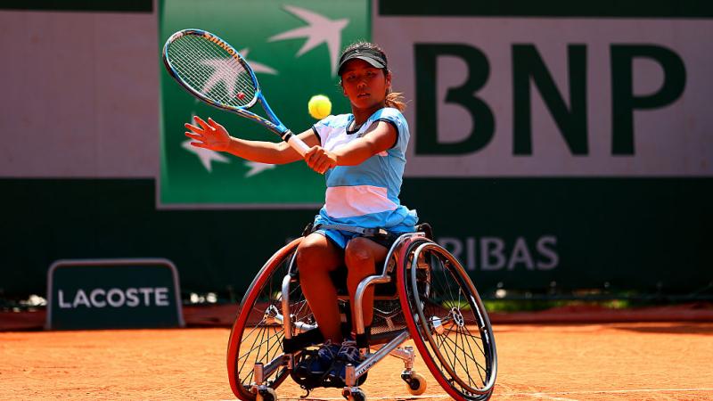 Yui Kamiji - French Open Japan's Yui Kamiji hits a shot at Roland Garros