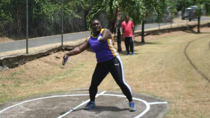 woman prepares to throw shot put