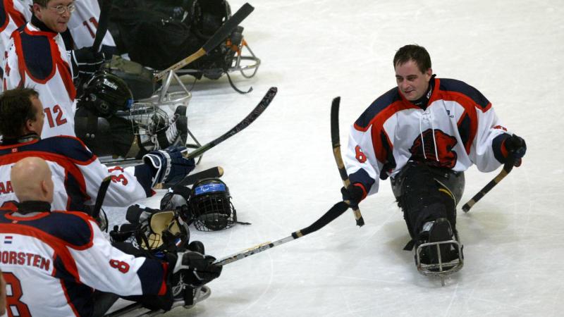 para ice hockey players on the ice