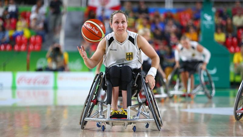 a wheelchair basketballer goes for a shot