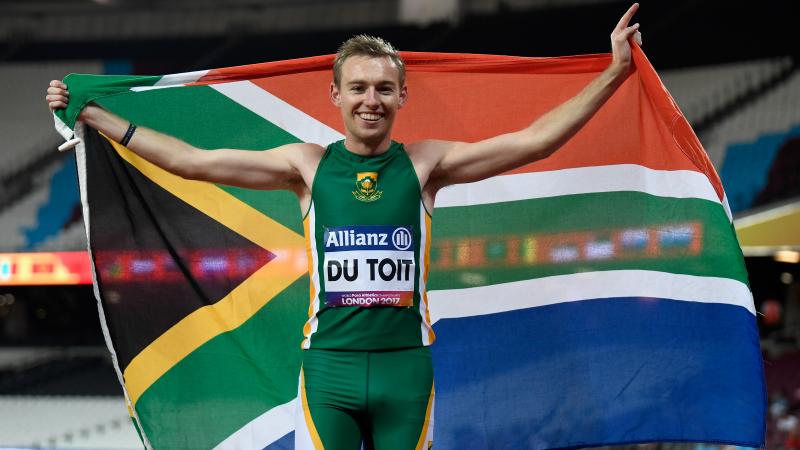South Africa's Charl Du Toit celebrates winning  gold in the men's 200m T37 at London 2017