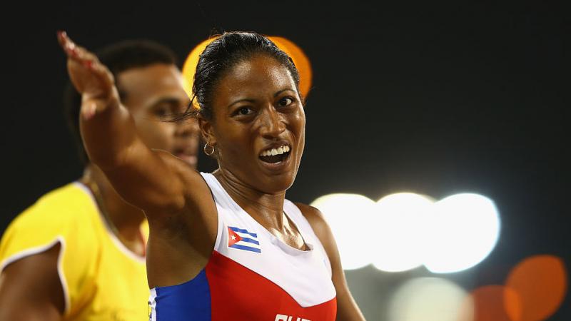 A female Para athlete celebrates after her race