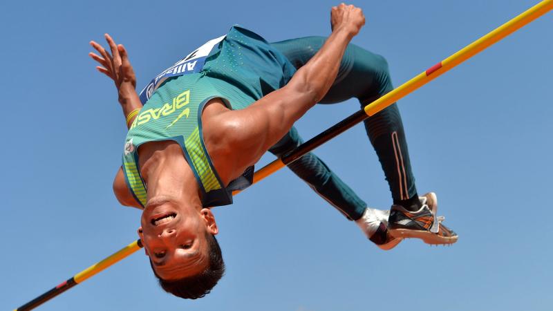 Brazilian athlete clears a bar in the high jump
