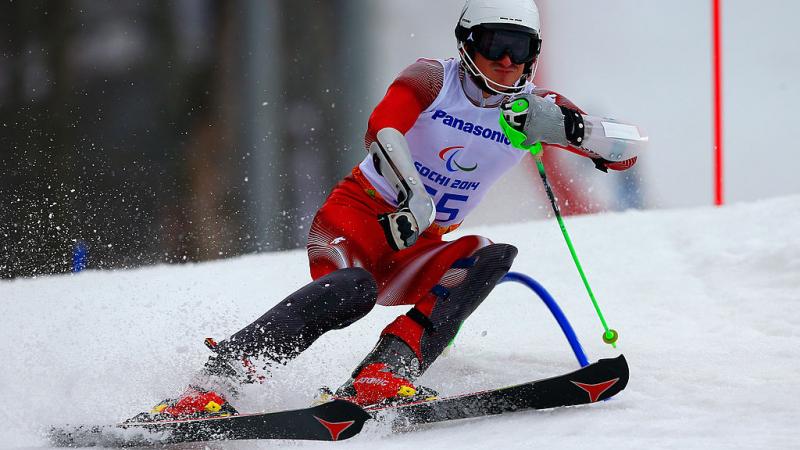 a Para skier goes through a gate